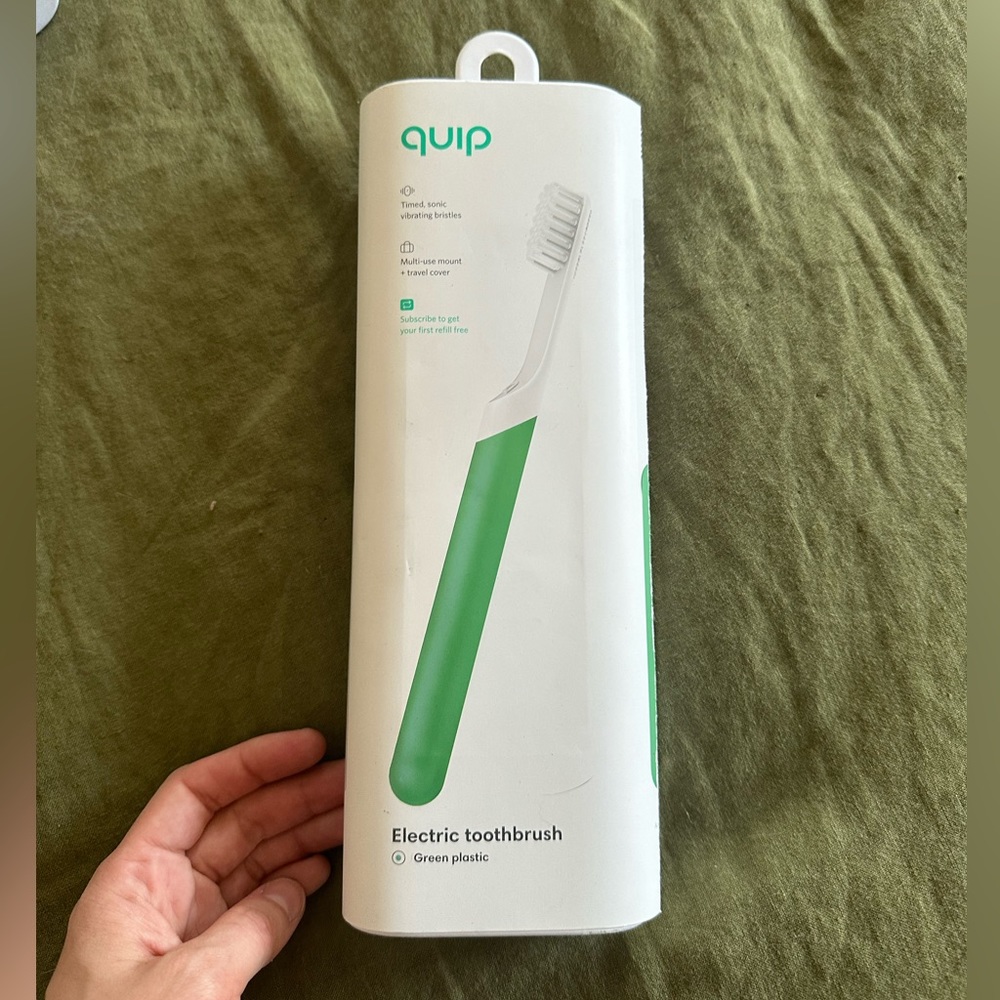 NWT Green Plastic Quip Electric Toothbrush
